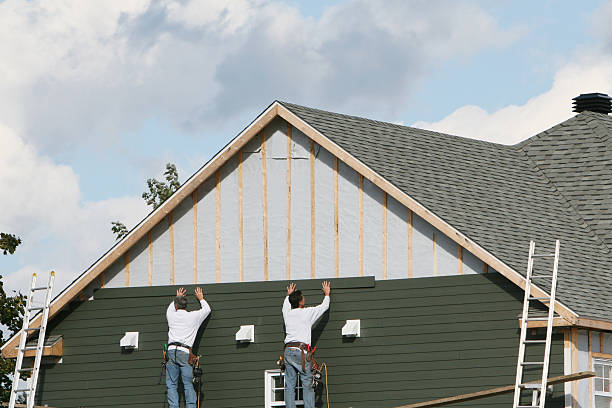 Professional Siding Replacement technician working in Capron, IL